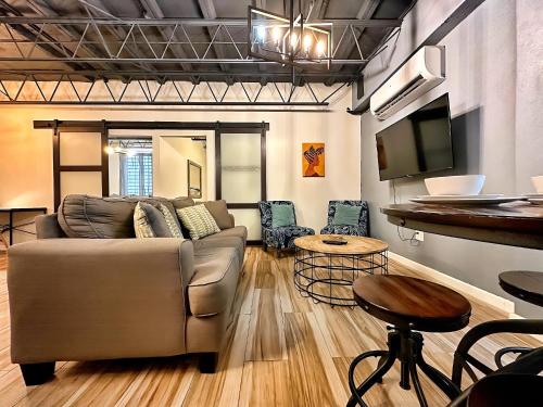 a living room with a couch and a table at The Lofts At Santurce in San Juan