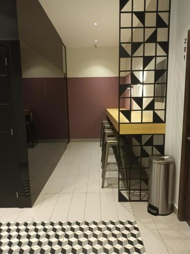 a bathroom with a black and white checkered floor at Executive Studio Apartment Zone 10 with Parking in Estación Pamplona