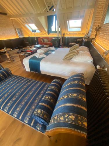 a hotel room with two beds and pillows at The Museum - Au Lit, Jérôme! in Antwerp