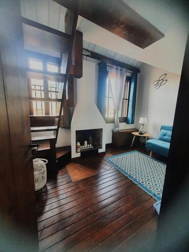 a living room with a couch and a fireplace at Ca' del Bovolo in Chioggia