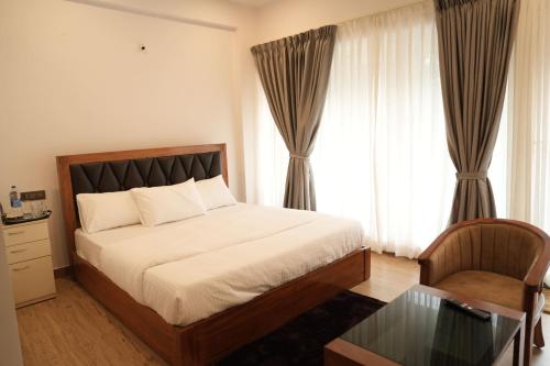 Letto o letti in una camera di Pallakki Comforts Chikmagalur