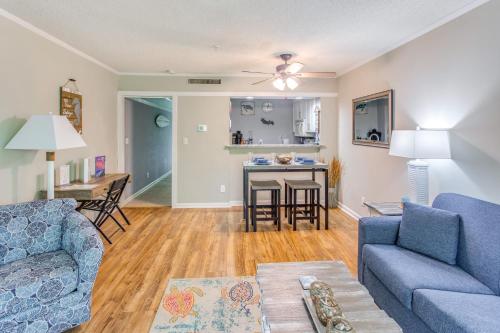 a living room with a couch and a table at Walk to Beach and Barefoot Landing Resort Condo! in Myrtle Beach
