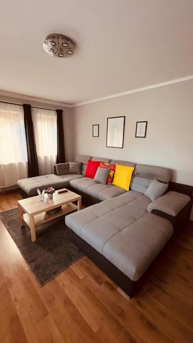a living room with a couch and a coffee table at Strigonia Apartman in Esztergom