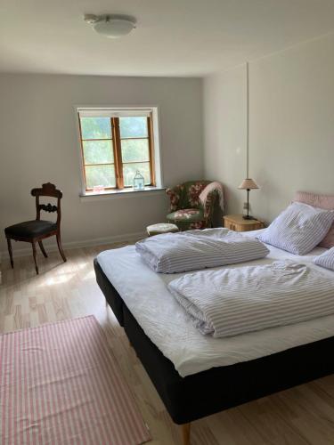 Postel nebo postele na pokoji v ubytování BnB Skovhuset