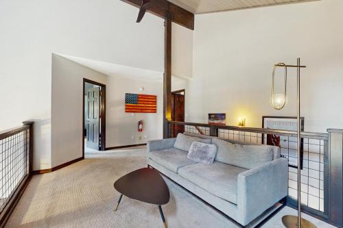 a living room with a couch and a table at Meadowview in Truckee