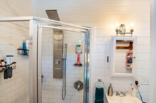 a bathroom with a shower and a sink at Tiny Home w Great Bay Views Pets Near Eglin Beach in Freeport