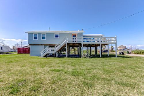a house with a large yard in front of it at The Showboat in Crystal Beach