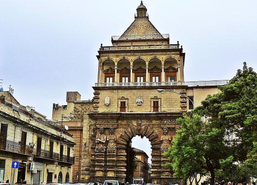 an old building with a clock tower on top of it at Dolce Sicily a 1km dal centro in Palermo