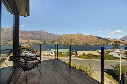 a balcony with a view of a lake and mountains at Viscount Haven - Lake Views in Queenstown