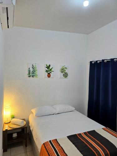 a bedroom with a bed and a desk with a night stand at Tu espacio ideal in San Miguel