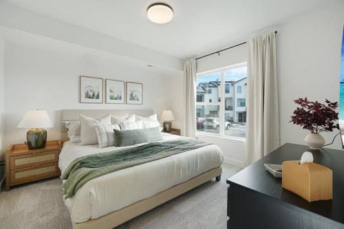 a bedroom with a large bed and a large window at UTMG 5967 #27 | The Foxtrot on Mesa Arch in Mountain Green