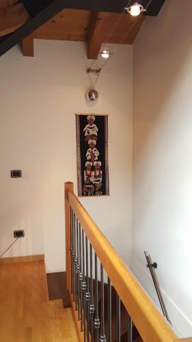 a stairway with a picture on the wall at Vicino ad Agripolis fra Venezia e Padova in un piccolo paese - Maya in Legnaro