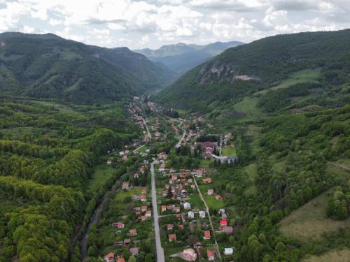 an aerial view of a village in the mountains at Waterfall Guest House in Ribarica
