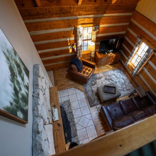 an overhead view of a living room in a cabin at Aspen - by The Chalets in Logan