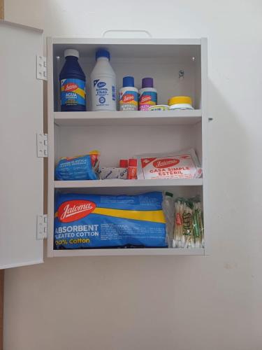 a cupboard filled with lots of cleaning products at Cabañas Mizontle in Mazunte