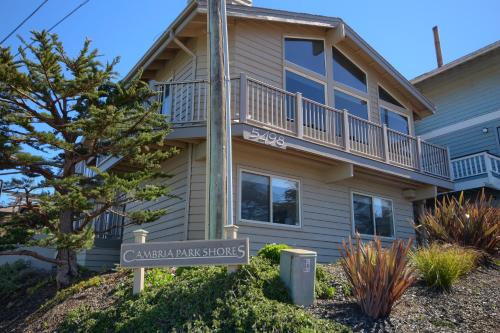 a house with a street sign in front of it at Cambria Park Shores in Cambria