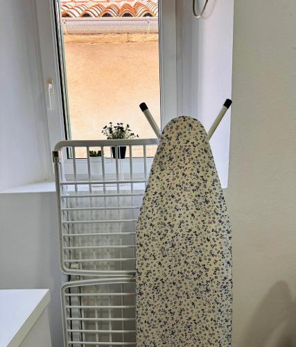 a towel hanging on a rack in a kitchen at 2 Charming Apartment in Kotor Old Town in Kotor