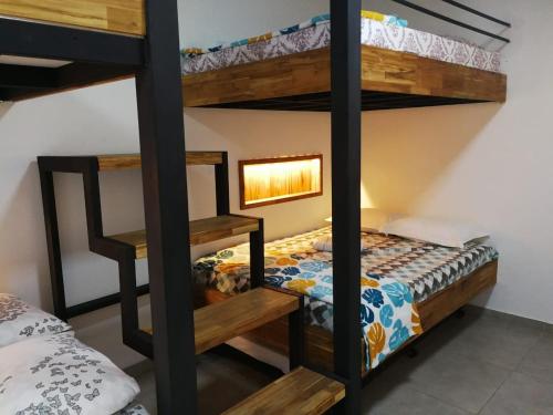 a bedroom with two bunk beds in a room at Monteclaro Campestre - En Sopetran in Sopetran