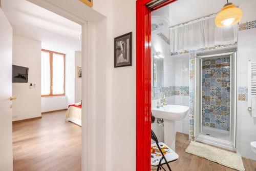 a bathroom with a white sink and a mirror at Bernadette Boutique in Naples