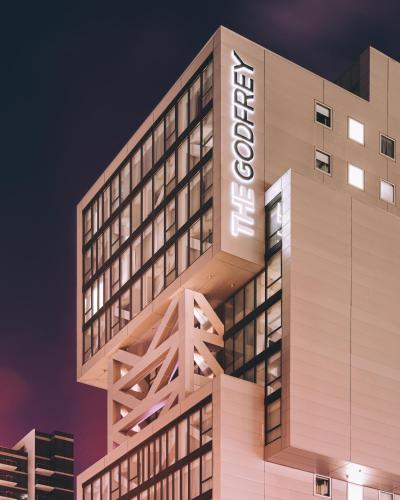 a building with a sign on the side of it at Godfrey Hotel Chicago in Chicago