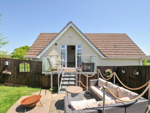 a small house with a fence and a patio at Treview in Launceston