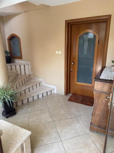 a room with stairs and a door and aoyer with at Zen Luxus Studio in Sidhirókastron