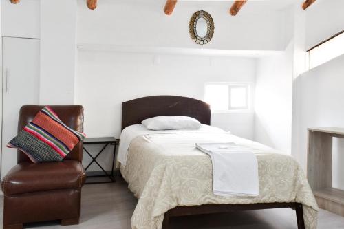 Postel nebo postele na pokoji v ubytování Apart Hotel El Puma