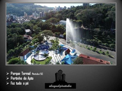 a picture of a water park with a waterfall at Apto climatizado 502, apenas 5 min das Thermas in Piratuba