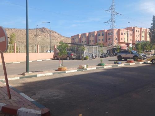 a street with cars parked on the side of a road at moroccan traditional equipped apartment in Marrakech