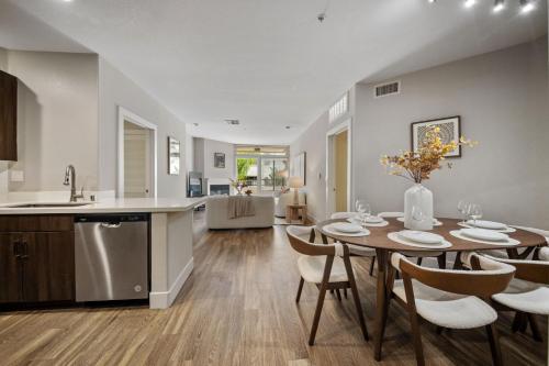 a kitchen and dining room with a table and chairs at Promo Casa Miel Heart of Westwood Luxury Condo in Los Angeles
