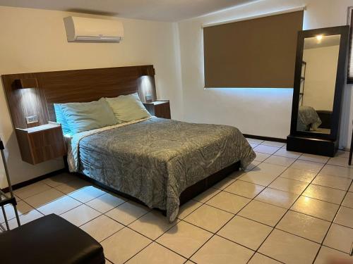 Postel nebo postele na pokoji v ubytování Departamento privado con cochera y WIFI alta velocidad