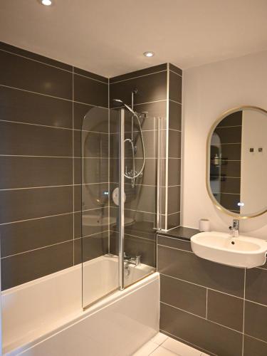 a bathroom with a shower and a sink at Spacious seaside apartment with terrace, Kemptown in Brighton & Hove