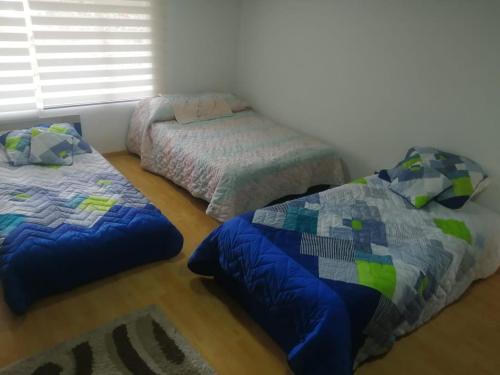 Letto o letti in una camera di Hotel Campestre Cabañas de la Sierra Nevada de el Cocuy Casa Quinta