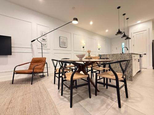 a dining room with a table and chairs at Magical 4BR Escape - Pet-Friendly, 9 Min to Disney in Orlando