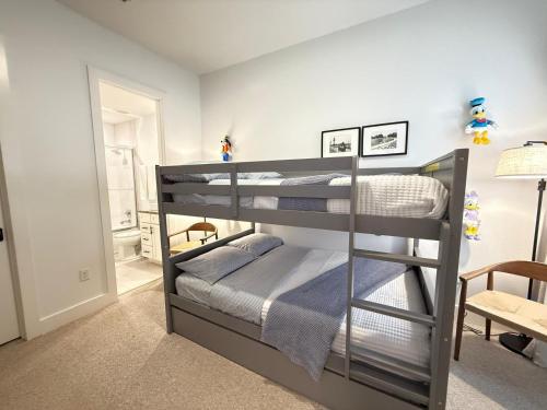 a bedroom with two bunk beds in a room at Magical 4BR Escape - Pet-Friendly, 9 Min to Disney in Orlando