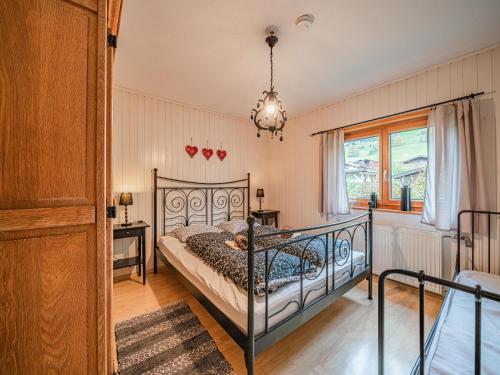 a bedroom with a bed and a window at Zirbenstubn in Piesendorf