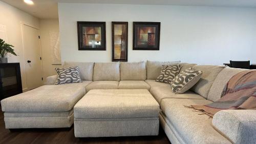 a living room with a couch with pillows on it at Homestead Village - Two Bedroom Condo Balcony in Sandpoint