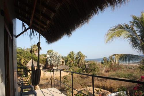 a view of the ocean from the balcony of a house at Casa Euskondido in Tlachicón