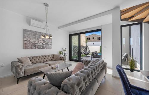 a living room with a couch and a table at Beautiful Apartment In Jezera With Wifi in Jezera