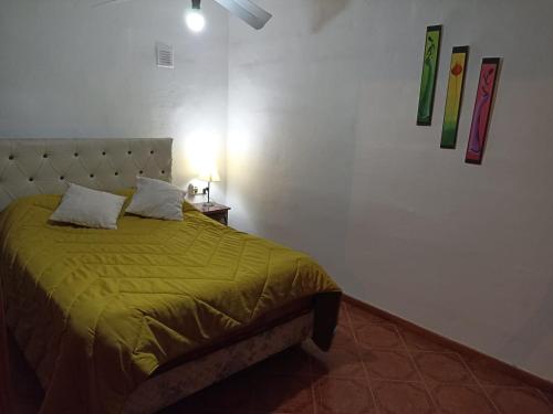 En eller flere senge i et værelse på Duplex la casita de papá