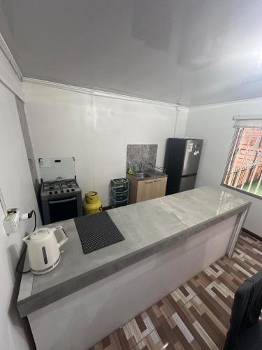 a kitchen with a counter top in a room at Casa Miraflores in Tocopilla