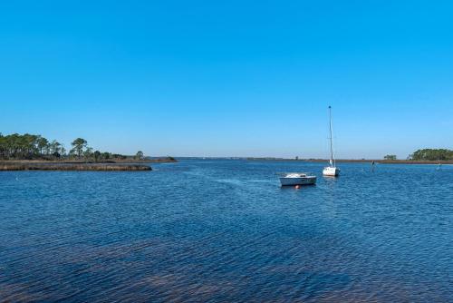 two boats in a large body of water at Coastal Soul in Santa Rosa Beach