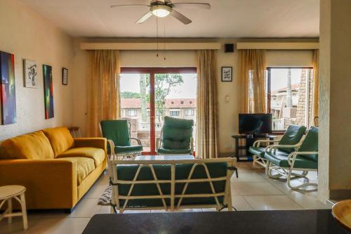 a living room with a couch and chairs at Southgate 3 in Margate