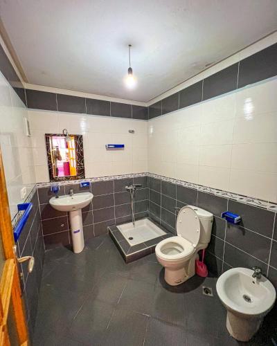 a bathroom with a toilet and a sink at Visit Chamal - Solaya in Oued Laou