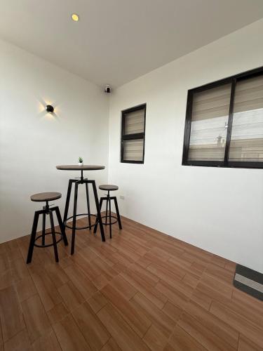 a room with two tables and two stools at DJS Home Studio Gensan Netflix,free wifi,hot&cold shower,near Airport in General Santos