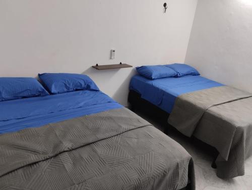 Postel nebo postele na pokoji v ubytování Casa León
