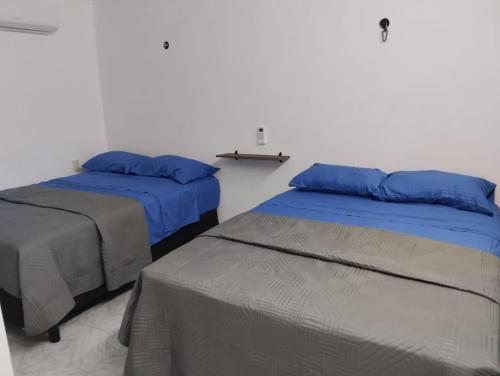 Postel nebo postele na pokoji v ubytování Casa León