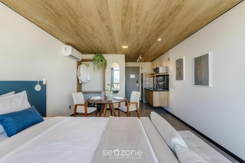 Una cama o camas en una habitación de NWTs - Estudios con vista lateral al mar en Maceió III