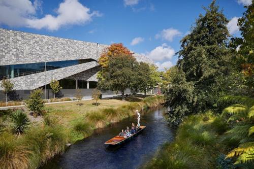 a group of people in a boat on a river at Better than the rest - Central City Luxury in Christchurch