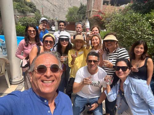 a group of people posing for a picture with wine glasses at Casa de Campo en Santa Eulalia in Santa Eulalia